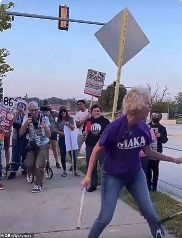Woman in Golden Rule Shirt Smashes Trump Piñata With Pipe