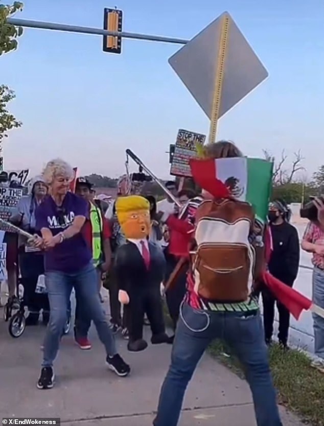 Woman in Golden Rule Shirt Smashes Trump Piñata With Pipe
